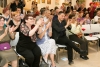The exhibition guests applauding the dancers of the Society for the Blinds