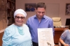 Beershebas Mayor Rubik Danilovich receiving the seven pictures from Ester Yossef and thanking for the seven pictures each one with biblical blessing 