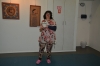 The artist Rahel Polisher in front of two pictures of the artist Melech Berger.Photographer Guillermo Rapoport