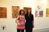 The artists Aliza Borshak and Ana Miron and their pictures back, from right to left : picture from Ana Miron, and the next three other pictures from Aliza Borshak.