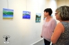 Visitors during the Opening looking at pictures from Exhibitions artist guests, students from artist Shula Rapoport.