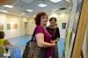 During the Opening the guest Zahavit with foundert and chairman of the Association "Fruits of Peace in israel" Gina Meir in front of the Exhibitions Poster.