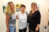 The artists Exhibition guests, students from artist Shula Rapoport, with their mother Marcel, in front of their pictures  