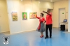 The dance teacher Ruhana Armoza Cohen with ilan Cohen beside the pictures from : left to right : the first from artist Ana Miron, the second and third from artist Gina Meir.