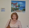 Artist Ruty Yotam in front of her picture