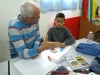 Artist Liber Gantman explaining a child the technique during his workshop in “Degania”
