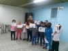 ”Fruits of Peace in Israel” artist Rachel Beatriz Moishe with “Deganias” children and their drawings during Rachels workshop “Telling a story”, Janusr 2019.
