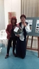 Artist Aliza Borshak presenting flowers for Gina Duellmann, artist, curator of the exhibition and chairwoman of the association