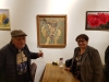 Artist Melech Berger, left showing his artwork and Mrs.Minah Kalman, Member of Beersheba's City Council and Lawyer, right.