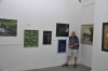 Asher Yisrael Kaplan near to his two photos artworks.