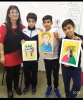 Fruits of Peace in Israel artist Ana Mirons workshop in "Portraits" for a class of elementary Jewish-Arabic school "Degania", Beersheba, November 2019, with children showing their ready paintings