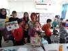 Fruits of Peace in Israel artist Aliza Borshaks explaining her workshop in "Painting motivated by Alizas Painting" for a class of elementary Jewish-Arabic school "Degania", Beersheba, November 2019