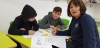 Children working on their drawings after Leonardo J. Grinbergs workshop for them, a class of elementary Jewish-Arabic school "Degania", Beersheba, December 2019