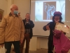 Artist Mrs Aliza Borshak delivering certificate for Artist Mr. Liber Gantman, Mr. Ysrael in the background.