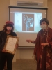 Gina Meir-Duellmann delivering certificate for artist Mrs. Aliza Borshak.